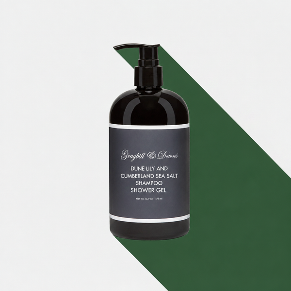 Dune Lily and Cumberland Sea Salt shower gel with a hunter-green long shadow