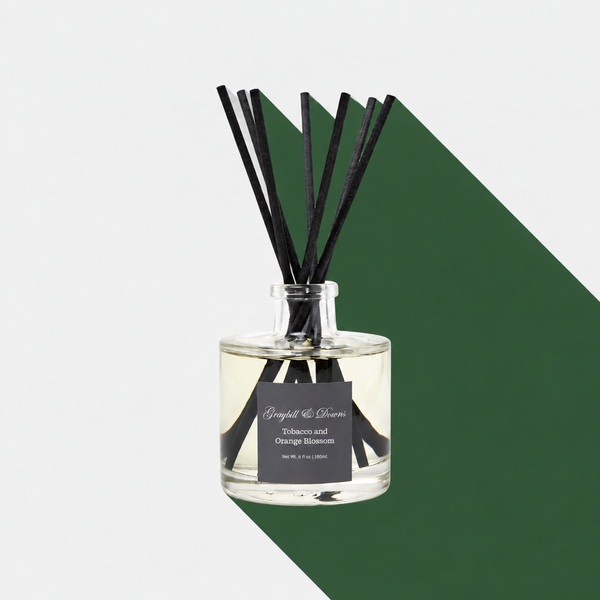 Tobacco and Orange Blossom diffuser with a hunter-green long shadow